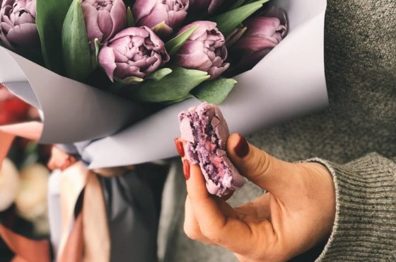 person-holding-pink-tulip-bouquet