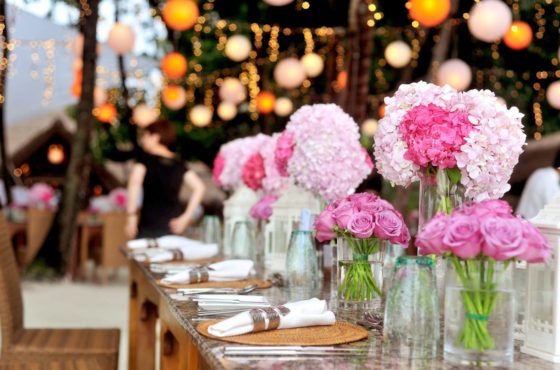 table-with-plates-and-flowers-filed-neatly-selective-focus